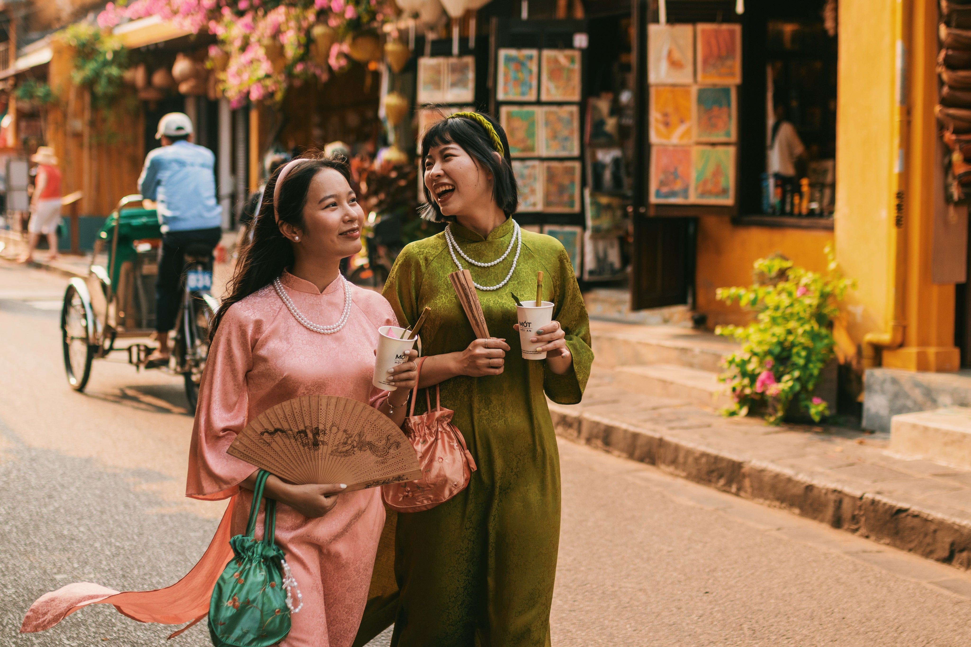 Central_Vietnam_Hoi_An_Thao_and_Davina_in_Ao_Dai_Walking.jpg